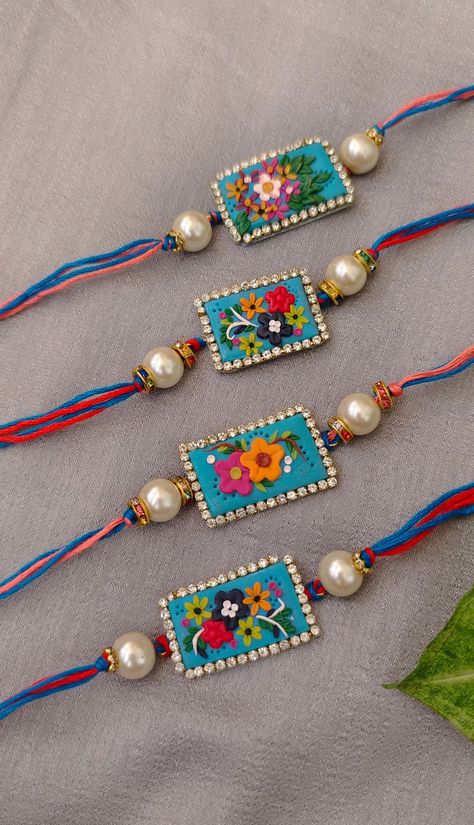 rura_creations@Instagram Quiling Rakhi Ideas, Polymer Clay Rakhi, Diy Rakhi Handmade Ideas, Clay Rakhi, Crochet Rakhi, Cardboard Crafts Decoration, Diy Crafts Easy At Home, Rakhi 2024, Handmade Decorative Items