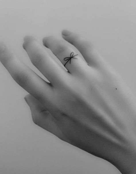 Small Tattoo Ideas for Your Zodiac Sign | Brit + Co Tiny Finger Tattoos, Small Finger Tattoos, Finger Tattoo For Women, Ring Finger Tattoos, Finger Tattoo Designs, Shape Tattoo, Muster Tattoos, Bow Tattoo, Small Tattoo Ideas