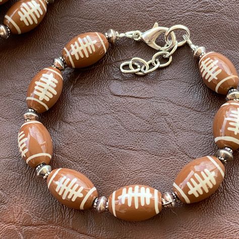 I love sporting my team colors, but sometimes I love having a piece that will follow me from game to game. As a football mom with three teams to support, it's nice to have one piece to wear to all the games. It also stacks beautifully with my other team bracelets.  Choose your length for the best fit. The measurements listed are for the bracelet without using the extender which will add an extra inch to the length.  Made with hand painted glass beads and silver plated components and accents.  Cu Football Jewelry, Team Bracelets, Football Bracelet, Mom Earrings, Mom Jewelry, Matching Jewelry, A Football, The Games, Gifts For Wine Lovers