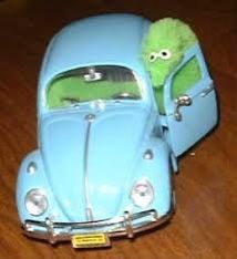 A light green, fuzzy, worm-on-a-string is climbing out of a worm-size blue car. It is threatening. Get In Loser, Going Shopping, Discover The World, World Of Fashion, Your Style, Volkswagen, Felt, Green, Blue