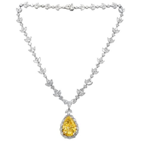 Platinum diamond necklace with GIA certified center 35.31 fancy intense vs2 yellow pear shape, GIA#2145952743 set in platinum handmade necklace, features 47.00ct of outside diamonds D/E/F VVS-VS quality. Plus center 1.50ct pear e vs1 GIA#24155411814 Yellow Diamond Jewelry, Most Expensive Jewelry, Expensive Necklaces, Yellow Diamond Necklace, Haute Jewelry, Drop Necklaces, Diamond Tattoos, Diamond Pendant Sets, Yellow Diamonds