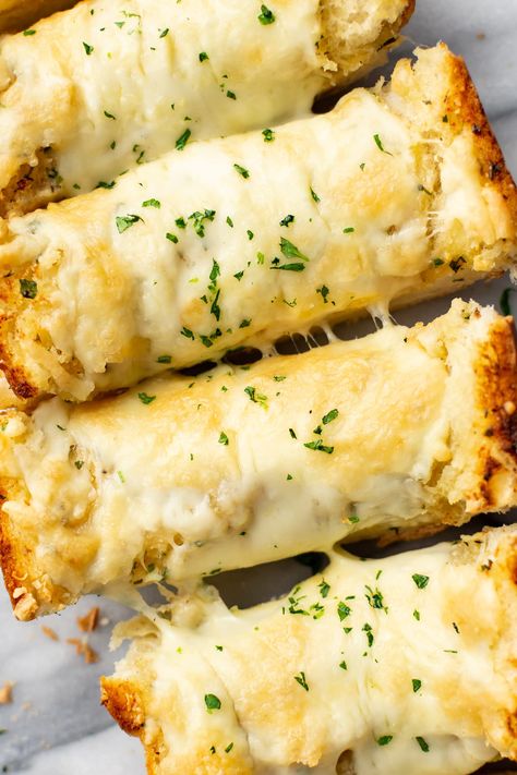 Buttery, perfectly toasted, and loaded with parmesan and mozzarella, this cheesy garlic bread recipe is one you'll want to serve with every meal! Cheesy Bread Sticks, Easy Garlic Bread, Salt And Lavender, Cheesy Garlic Bread Recipe, Salt Lavender, Make Garlic Bread, Homemade Garlic Bread, Lavender Recipes, Garlic Cheese Bread