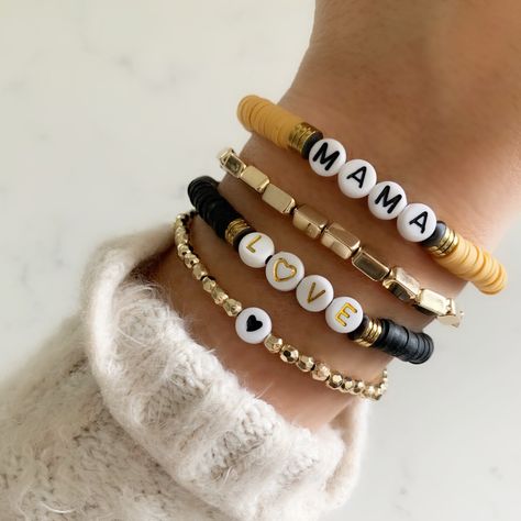 "Brand new to the Louis and Finn, our heishi beads + mixed metal golds have quickly become an arm party must have! So cute! So fun! Personalize with your wording!  ≫ PRODUCT DETAILS ◈ 1. All letters are capitalized  ◈ 2: Use the personalize box at checkout to list wording/numbers/symbols ◈ 3. These bracelets are made with a standard opening size of 7\", but tend to have a more snug fit so the letter beads sit on top of the wrist. *PLEASE NOTE: if you would like the opening smaller/larger this ne Bracelets Heishi, Heishi Bracelets, Numbers Symbols, Homemade Bracelets, Name Bracelets, Bracelet Keychains, Multiple Bracelets, Bracelets Design, Clay Bracelet