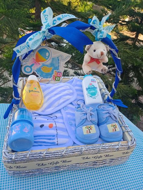 It's a boy themed gift hamper ideas Newborn Hamper Ideas, Gift Hamper For Newborn, Newborn Baby Gift Hamper, Baby Boy Gifts Basket, Gift Basket For Baby Boy, Baby Hamper Ideas Baskets, Baby Boy Gift Ideas Newborn, Baby Boy Hamper Ideas, Baby Boy Gift Wrapping Ideas