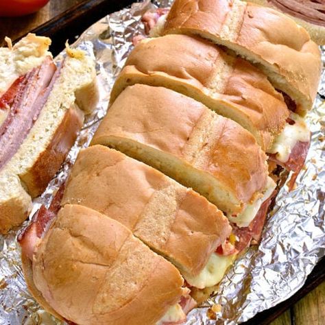 Italian Party Sub - Lemon Tree Dwelling Italian Vinaigrette, Lemon Tree Dwelling, Italian Themed Parties, Sliced Salami, Italian Sub, Italian Party, Turkey Ham, Italian Theme, Appetizer Sandwiches