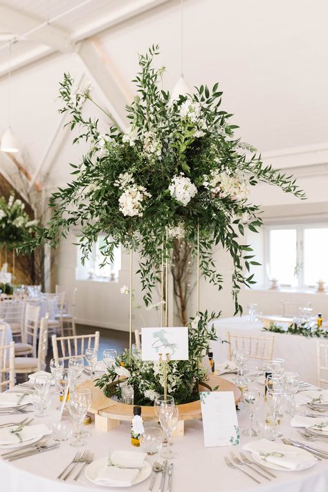 Wedding Greenery Arrangements, Green Centrepiece Wedding, Green And White Tall Centerpieces, White Flower Centrepiece Wedding, Wedding Table High Centerpieces, Greenery And White Flowers Centerpieces, Green And White Flower Arrangements Tall Centerpiece, Tall Table Centerpieces Wedding, Tall Table Decorations Wedding