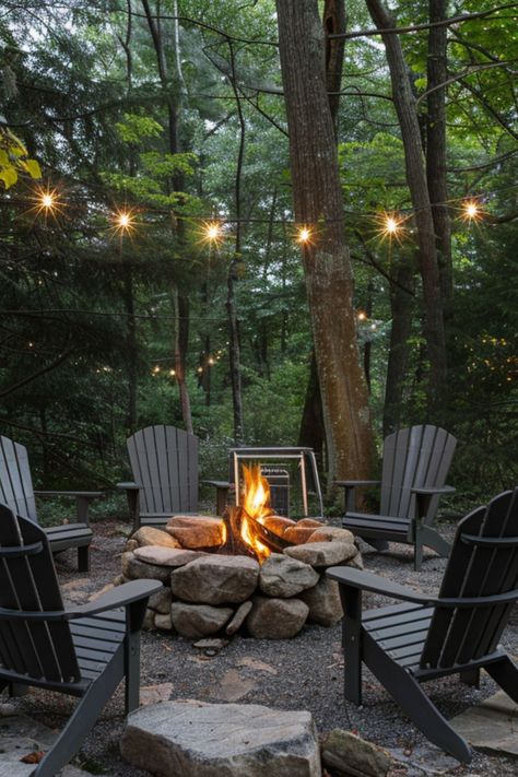 Get inspired with 40 unique backyard fire pit designs that fit any small yard. These simple, budget-conscious ideas include DIY options for both square and round pits, perfect for creating a cozy outdoor lounge space. Fire Pit Lakeside, Fire Pit In The Woods Ideas, Forest Lounge Ideas, Fire Pit Cabin, Fire Pit Cottage, Rustic Firepit Outdoor, Large Rock Fire Pit, Rock Fire Pit Ideas Backyard, Forest Fire Pit