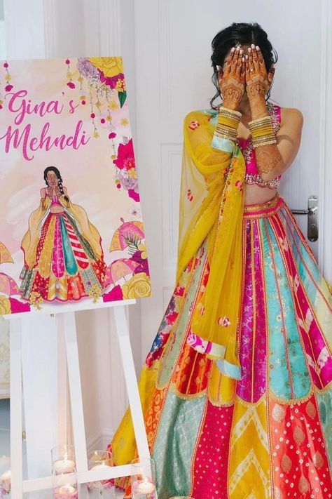 We are obssessed with how this bride’s mehendi artwork is replicating her mehendi day look ! Always dreamed of your Mehndi to be a colorful, boisterous affair? Well, you don't always need an OTT decor to spread that vivaciousness & quirk, when your attire can do the magic. Why dress basic even if it is an intimate, low-key celebration? Mehendi Dress, Haldi Ceremony Outfit, Haldi Dress, Mehndi Outfit, Mehendi Outfit, Haldi Outfits, Haldi Outfit, Mehendi Outfits, Lehenga Designs Simple