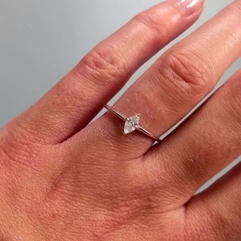 The minimalist engagement ring of dreams... 💍✨️ This pretty sterling silver ring features a simple marquise cut cz in a 4 prong setting. With just a 1mm band width and depth, it makes an ideal dainty and affordable engagement ring ready to be stacked with the future wedding ring! 😍 . . . #Engagement #Engaged #EngagementRing #SterlingSilver #Jewellery #Ring #MarquiseCut #MarquiseRing #BridalSet Rings Engagement Silver Simple, Minimalist Wedding Ring Silver, Simple Wedding Ring Stack, Simple Engagement Rings Dainty, Engagement Rings Dainty, Affordable Engagement Ring, Wedding Ring Stack, Simple Wedding Ring, Rings Dainty