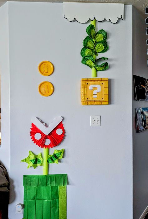 Themed party decor. Made with paper plates, pool noodle, poster board, and tissue paper Noodle Poster, Super Mario Party, Video Game Party, Pool Noodle, Mario Bros., Classroom Theme, Mario Party, Classroom Design, Trunk Or Treat