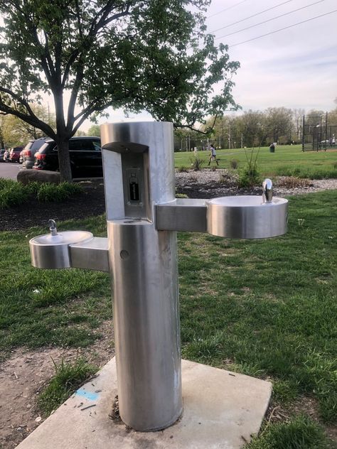 This pedestal-mounted water bottle filling station with bi-level, push-button drinking fountains is a park favorite. Its stainless steel construction makes it resistant to sunlight, heat, moisture, and other wear, and a heavy-duty, vandal-resistant access cover provides additional durability. #DrinkingFountain #OutdoorDrinkingFountain Drinking Fountain Design, Water Bottle Filling Station, Outdoor Drinking Fountain, Bottle Filling Station, Drinking Water Fountain, Pet Fountain, Drinking Fountains, Fountain Design, Water Fountains Outdoor