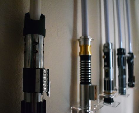 Star Wars: Galaxy's Edge - Our Lightsaber Display - Anakin and His Angel Lightsaber Display Wall, Star Wars House Decor, Star Wars Living Room, Lightsaber Collection, Lightsaber Display, Build Your Own Lightsaber, Darth Vader Lightsaber, Star Wars Bedroom, Star Wars Nursery