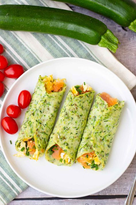 Veggie-loaded zucchini tortillas are a delicious, low-carb, high-protein breakfast wrap that you can load up with your favorite toppings! Add some scrambled eggs and lox to these tortilla wraps for a high protein breakfast, or serve these zucchini wraps with breakfast potatoes. Make a batch of zucchini wraps and reheat for a quick and easy weekday breakfast! Egg And Veggie Breakfast Wrap, Fruit And Veggie Breakfast Ideas, Zucchini Wraps, Loaded Zucchini, Wraps Recipes Vegetarian, Zucchini Tortillas, Breakfast Zucchini, Glow Challenge, Easy Wraps