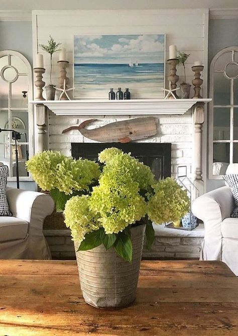 Fireplace decor ideas for those who love the sea. Some simple coastal and nautical ideas for your fireplace. Featured on Completely Coastal. Coastal Fireplace Ideas, Beach House Fireplace, Coastal Mantle Decor, Beach Fireplace, Hearth Decor, Coastal Fireplace, Farmhouse Mantle Decor, Farmhouse Fireplace Decor, Farmhouse Mantle