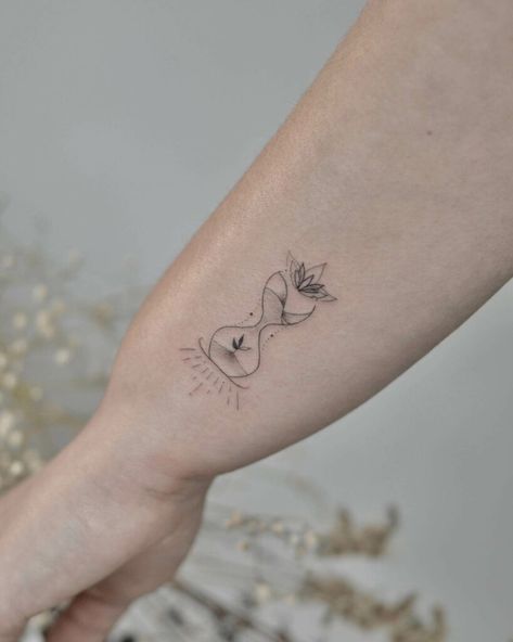 12+ Girly Hourglass Tattoo Ideas To Inspire You! - alexie Tattoos Representing Time, Hourglass Wrist Tattoo, Hourglass Small Tattoo, Feminine Hourglass Tattoo, Phd Tattoo Ideas, Hour Glass Tattoo Designs For Women, Hourglass Tattoo Feminine Small, Minimalist Hourglass Tattoo, Tattoo About Time