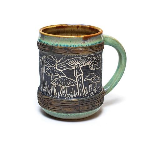 #mushroom #sgraffito #ceramics #coffeemug #mushroomtea #mycelium #forage #psilocybinmushrooms #psychedelics #psychedelicart #naturalworld #folkart #wheelthrownceramics #handmade #estyshop #mushroomlover #shrooms #mugsofinstagram #potterycollector #mugcollector #mountainart #healingfoods #naturelover #hiking #valentinesgift #localart #coffeelover #mugcustom #naturalart #mugshot Sgraffito Mushrooms, Mushroom Sgraffito, Sgraffito Ceramics, Sgraffito Designs, Sgraffito Pottery, Mushroom Tea, Wheel Thrown Ceramics, Forest Style, Glazing Techniques