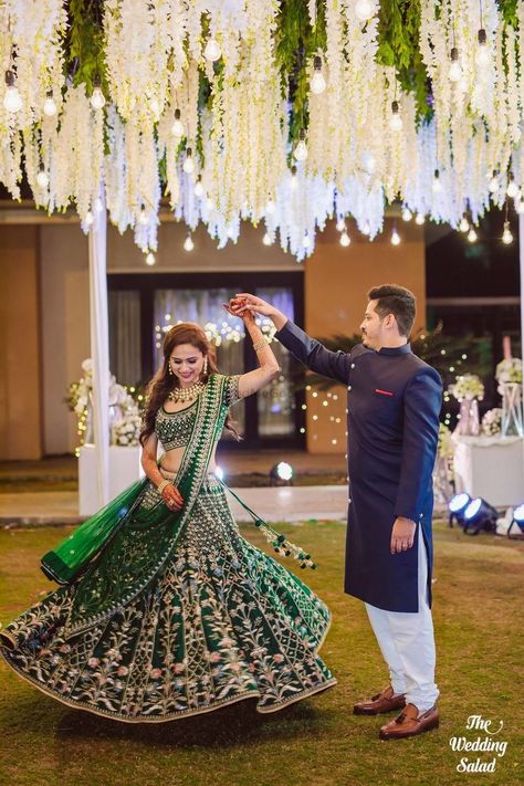 Photo of Bride twirling in dark green lehenga with groom Dark Green Lehenga, Engagement Lehenga, Bride Indian, Indian Wedding Lehenga, Mumbai Wedding, Couple Wedding Dress, Bengali Bride, Green Lehenga, Indian Wedding Planning