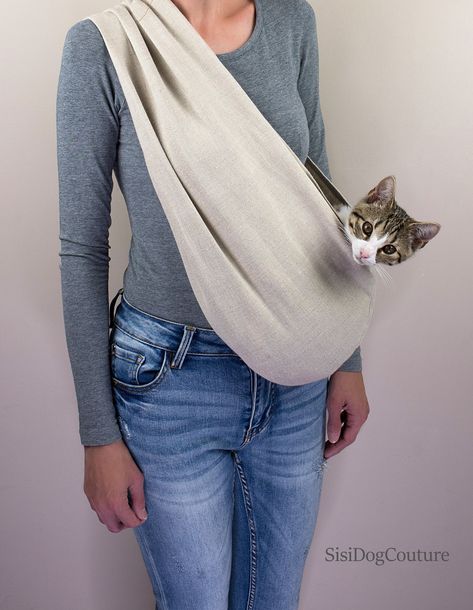 Linen Cat Sling for Cats is ideal for use any time of the day when you need to quickly and safely transport your little  furbaby.   Like the baby, cats feel the best when we hold them in their arms, it gives them a sense of closeness and calms them down. Cat carrier is made of a good quality stretchable and breathable cotton fabric that  that is soft and comfortable to use. All the seams are sewn thrice for durability.  Cat sling color- beige This versatile pet carrier can accompany you and your cat anywhere you want to go. Our cat bags are very light and easy to fold.  The Cat Carrier has a leash to attach your pet. Toy: 0 - 1,36 kg (0-3 Ibs) Small: 1,36 - 2,5 kg (3 - 5.5 lbs) Medium: 2,5 - 5 kg (5.5 - 11 lbs) Large: 5 - 8 kg (11 - 18 lbs) ✿YOUR SIZE✿ Measure from the upper edge of the ar Cat Sling, Cat Carrier Bag, Sphynx Cat Clothes, Pet Sling, Sling Carrier, Shoulder Sling, Modern Pet, Cat Bag, Cat Carrier