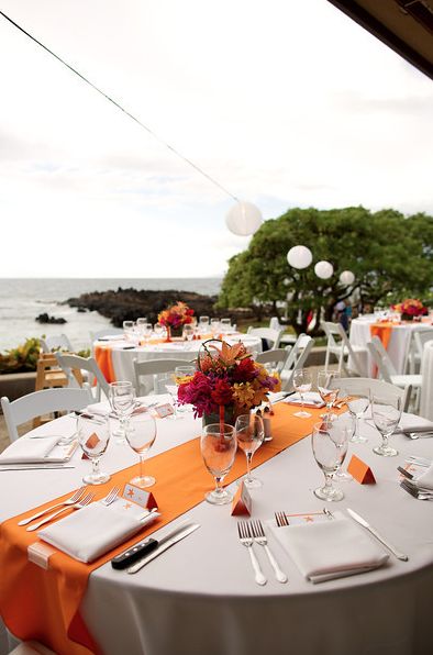 Round DIning Table with Orange Runner White And Orange Table Setting, Orange And Beige Party Decor, Orange Table Cloth Wedding, Orange And White Wedding Decorations, Sunset Table Setting, Orange And White Party Decor, Wedding Table Orange, Orange Quinceanera Theme, Orange Table Setting