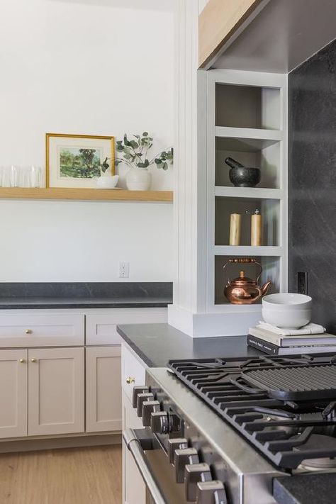 A stove alcove is filled with an integrated gas cooktop flanked by white built-in shelves. Cooking Alcove, Kelsey Leigh Design Co, Range Alcove, Marble Slab Backsplash, Stove Alcove, Kelsey Leigh Design, Beach Cottage Kitchens, Blue Backsplash Kitchen, Slab Backsplash