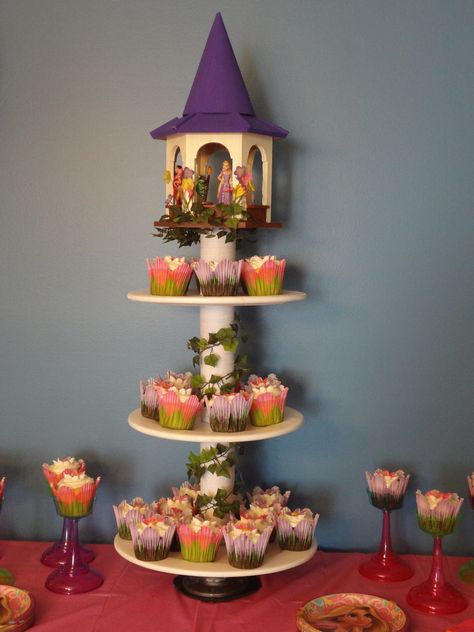 **Rapunzel's Cupcake Tower**   Took a little while but so worth it!!! Rapunzel Cupcake Tower, Tangled Cupcakes Ideas, Tangled Cupcakes, Rapunzel Cupcakes, Rapunzel Wedding Theme, Cupcake Papers, Rapunzel Wedding, Tangled Wedding, Tangled Birthday Party