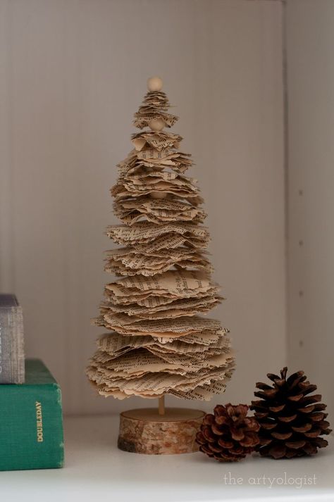 I made this little Christmas tree last year out of old book pages, and it's still one of my favourite decorations this year! It was so easy to make too. #diy #upcycled #christmascraft #christmasdecor #bookpages #oldbooks Old Book Page Crafts Diy Projects, Old Book Diy Decor, Book Paper Christmas Trees, Book Page Christmas Tree Diy, Book Pages Tree, Readers Digest Christmas Tree, Storybook Christmas Decorations, Book Paper Christmas Decorations, Christmas Book Page Crafts