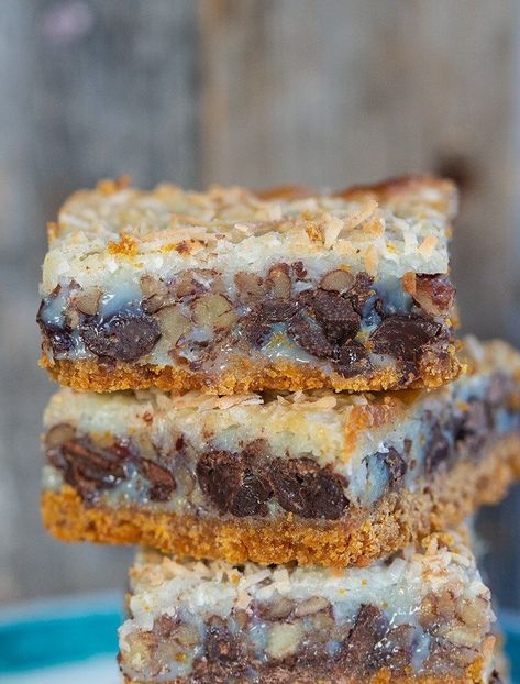 Magic Cookie Bars Recipe - The Kitchen Magpie Magic Cookie Bars Recipe, Magic Cookie Bar, Crunch Bars Recipe, Brownies Cupcakes, Magic Bars Recipe, Magic Cookie Bar Recipe, Magic Cookie Bars, Condensed Milk Recipes, Square Recipes