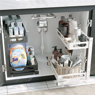 Cabinet organizer's bottom slide-out drawer makes access to restricted areas easier and makes the most of small spaces. The upper and lower trays are adjustable and removable, with L-shaped sliding design to increase more storage space. The bottom area can hold up to 11" bottles, enough to store in most bathrooms or kitchens. Made of high quality steel, if you don't want it to move, use the sponge double-sided adhesive at the bottom to hold the position | Rebrilliant Under Sink Organizer | Organ Bathroom Shelves Under Sink, Bathroom Undersink Storage, Lower Cabinet Organization, Restroom Organization, Undersink Organization Bathroom, Under Sink Storage Kitchen, Diy Pull Out Shelves, Bathroom Cabinet Organizer, Under Sink Drawer