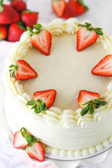 Layered with a tangy 4-ingredient cream cheese frosting, this sweet and tender Strawberry Cake is a fresher, yummier version of your favorite box mix! #strawberrycake #creamcheesefrosting #strawberrycakemix #strawberrydessert #homemadecake #cakerecipes #frostingrecipes #dessertideas Strawberry Filling Recipe, White Cake With Strawberry Filling, Homemade White Cake, Strawberry Cake Decorations, Cake With Strawberry Filling, Life Love And Sugar, Strawberry Layer Cakes, Homemade Strawberry Cake, Cake With Strawberry