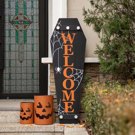 The wood large coffin porch sign is made of black painted MDF, with white cobweb printing, and the message of "WELCOME" in orange letters. It will scare you in your home or office for Halloween party seasons but shows your welcome and decorate your porch in the same time.1. Lean against a wall or hang it on the wall with jute rope on the back2. Classic black/orange color and unique design3. No assembly required, easy to move and storage for reuse Halloween Welcome Board, Halloween Boards Signs, Painted Halloween Signs, Coffin Halloween Decor, Halloween Signs Wooden, Front Door Halloween Decor, Welcome Sign Halloween, Buffet Halloween, Décoration Table Halloween