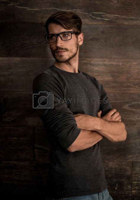 hipster guy wearing glasses with his arms crossed on a dark back #Ad , #glasses, #arms, #crossed, #dark Guy Arms Crossed Reference, Crossed Arms Drawing Reference Male, Person With Arms Crossed Reference, Guy Hands In Pocket Pose, Person Adjusting Glasses, Man Arms Crossed Reference, Guy With Arms Crossed, Crossed Arms Reference Male, Guy Crossing Arms