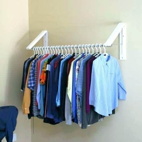 Do you get frustrated at the clutter and lack of space in your small bedroom and closet? Are you trying to downsize or move to a more minimalist lifes... | Use Hanging Brackets to Put Up Clothes #smallbedroom #bedroom #bedroomorganization Clothes Storage Solutions, Clothes Storage Systems, Clothes Hanger Storage, Small Bedroom Organization, Small Laundry Room Organization, Diy Clothes Rack, Room Storage Diy, Clothes Closet Organization, Wall Decoration Ideas