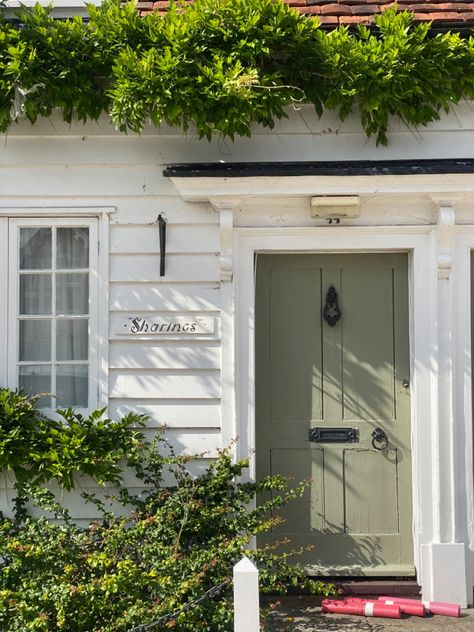 Green Door Cottage, Sage Green Exterior Trim, Sage Green Trim Exterior Houses, White House Sage Green Door, White House Sage Green Trim, White House With Sage Trim, Light Green Shutters White House, Sage Front Door Brick House, Cottage Exteriors Colours