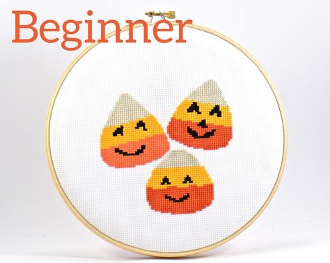 This easy candy corn counted cross stitch pattern is perfect for a beginner.  This sweet pattern would make a fun project for the new cross stitch learner.  Featuring three orange and yellow candy corn with quirky faces.  The best thing about these candy corn is there are no calories involved.  And if you run into any questions, my instructions and tips guide will get you on your way. The cross stitch pattern features unique symbols with its coordinating color so there's no guessing what thread Cross Stitch Cute, Easy Candy, Stitch Cute, Yellow Candy, Unique Symbols, Halloween Embroidery, Halloween Goodies, Hand Embroidery Kit, Personalized Embroidery