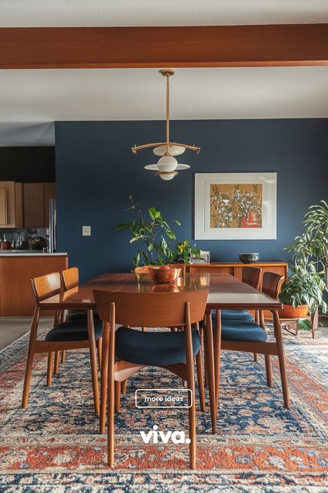 ♥ Are you ready to upgrade your dining room with a touch of Mid Century modern elegance? Feast your eyes on this stunning dining room featuring a stylish Mid Century modern dining room table and colorful wall art. Get inspired with Mid Century modern dining room decor ideas now! 🍽️🎨 #mcmdinningroom #midcenturydecor #diningroominspiration Boho Mid Century Dining Room, Dining Room Table Centerpiece Ideas Modern Mid Century, Mid Century Meets Traditional, Moody Mid Century Dining Room, Jewel Toned Dining Room, Dining Mid Century Modern, Deep Blue Dining Room, Peacock Blue Dining Room, Mid Century Modern Doors Interior