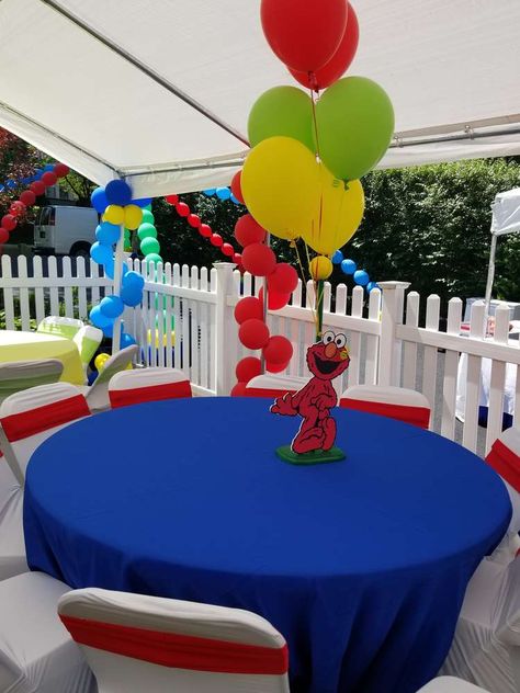 Elmo Party Outfit Parents, Sesame Street Treat Table Ideas, Elmo Birthday Centerpieces Ideas, Elmo Centerpiece Ideas 1st Birthday, Sesame Street Birthday Party Ideas 1st Boy, Sesame Street Table Centerpiece, Sesame Street Birthday Centerpiece Ideas, Sesame Street Centerpiece Ideas Diy, Elmo 1st Birthday Party Boys