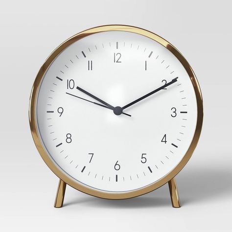 Introduce a minimal yet catchy timepiece to your space with the 6" Polished Metal Mantle Clock with Alarm Brass from Threshold™. This analog clock features a classic white clock face, beautifully complemented by its metal construction. With it's polished design it makes for a great piece that seamlessly brings together style and functionality. Threshold™: Looks like home, feels like you. Metal Mantle, Room Wishlist, White Clock, White Clocks, Retro Table, Table Clocks, Analog Clock, Alarm Clocks, Tabletop Clocks