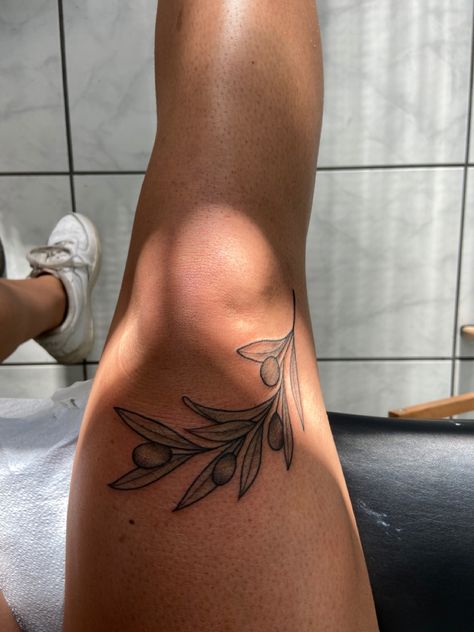 Leaf Tattoos For Women Leg, Leg Leaves Tattoo, Olive Branch Tattoo Thigh, Food Tattoo Sleeve, Olive Branch Leg Tattoo, Plus Size Tattoo Placement, Botanical Leg Tattoo, Around The Knee Tattoos Women, Tattoo Branch