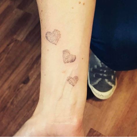 Family fingerprints tattoo on the inner forearm. 3 Thumbprint Tattoo, 3 Finger Print Tattoo, 3 Fingerprint Tattoo Ideas, Family Finger Print Tattoo, Three Thumbprint Tattoo, Finger Print Tattoo Ideas Family Trees, Three Fingerprint Tattoo, Family Fingerprint Tattoo, Thumbprint Flower Tattoo