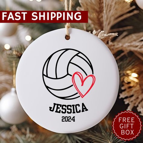 🏐 Personalized Volleyball Christmas Ornament 2024 🏐 Celebrate the spirit of volleyball with this 3-inch ceramic ornament--the perfect gift for any volleyball player, mom, coach, or team! This beautifully crafted ornament is a great way to commemorate the 2024 volleyball season, making it an ideal holiday keepsake for seniors, players, and fans alike. Product Highlights: 3-inch ceramic ornament with vibrant, high-quality print--ideal for hanging on your Christmas tree or displaying as decor. Personalize with the player's name, team name, or "Volleyball Season 2024" to create a meaningful, custom touch. Perfect for volleyball moms, teams, and coaches to celebrate achievements or share as a team gift. Design: Features a sleek volleyball graphic with space for personalized text, making it a Volleyball Christmas, Volleyball Ornaments, Custom Volleyball, Senior Night Gifts, Volleyball Gifts, Volleyball Mom, Volleyball Player, Senior Night, Gift Design