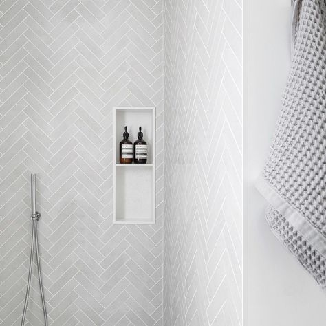 30 Amazing Herringbone Tile Bathroom Ideas To Sprinkle Personality Bathroom White Herringbone Tile, Herringbone Tile Floor Small Bathroom, White Subway Herringbone Bathroom, Bathroom Herringbone Tile Floor Master Bath, Large Subway Tile Shower White Herringbone, Herringbone Tile Wall Bathroom, Shower With Herringbone Tile, Bathroom Remodel Herringbone Tile, Herringbone Bathroom Ideas