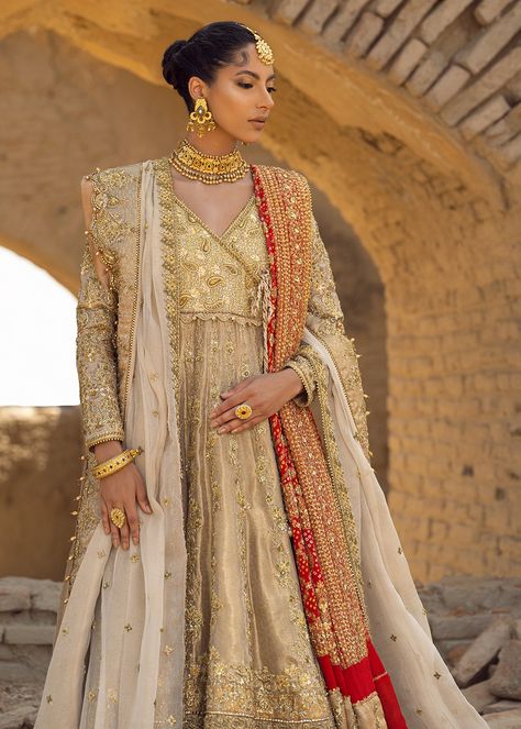 Color: Ivory gold Includes: Angharka: Pure mesori lame Dupatta: Tissue mesori Lehnga : Mesori Product Descriptions: A pure mesori lame ivory gold angharka peshawas, the bodice and sleeves are fully handwork. The flare of the peshwas has handwork on the panels and resham with merori borders on the hem of the peshwas. It is paired with pure mesori lehnga with vasli and zardozi laden borders paired with a tissue mesori duppatta with heavy zardozi scalloped borders. Delivery Time: 6-8 months. Note: Angharka Style, Golden Bridal Lehenga, Angrakha Dress, High Low Gown, Pure Chiffon, Pakistani Designers, How To Dye Fabric, Bridal Lehenga, Bridal Outfits