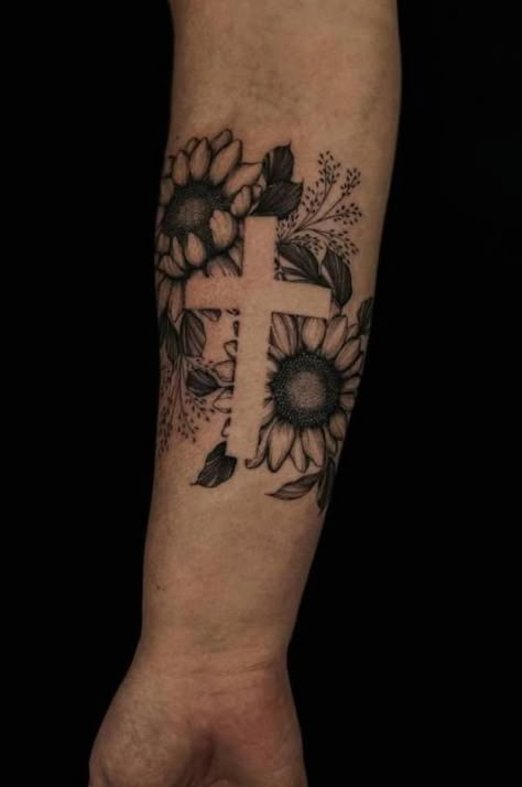 Sunflower cross tattoo Cross Negative Space Tattoo, Negative Space Sunflower Tattoo, Tattoo Ideas Female Cross For Women, Cross With Butterflies Tattoo, Men Sunflower Tattoo, Cross And Sunflower Tattoo, Wildflower Cross Tattoo, Western Sunflower Tattoo, Cross With Sunflower Tattoo