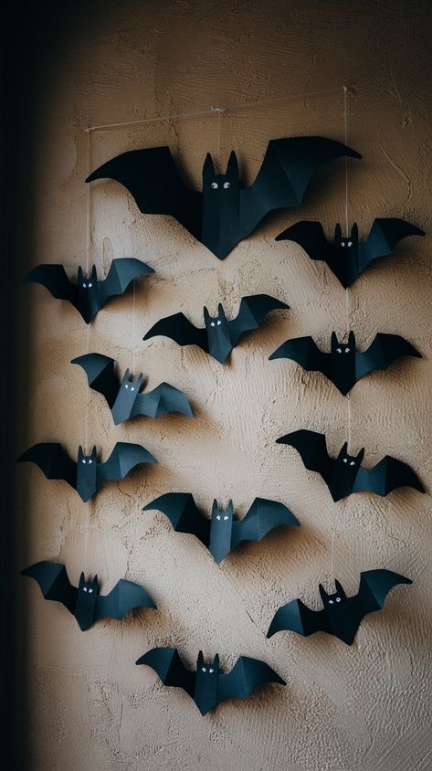 Add a spooky touch to your Halloween decor with these DIY paper bats! Perfect for creating a haunting atmosphere, these easy-to-make wall decorations bring a festive flair to any room. Simply cut out bat shapes from black construction paper and arrange them in a flight pattern across your walls. Bat Window Decor, Halloween Craft Construction Paper, Construction Paper Crafts Aesthetic, Diy Halloween Decorations With Construction Paper, Construction Paper Halloween Decorations, Garage Door Halloween Decor Diy, Paper Bats On Walls, Paper Bats Diy, Homemade Halloween Decorations Indoor