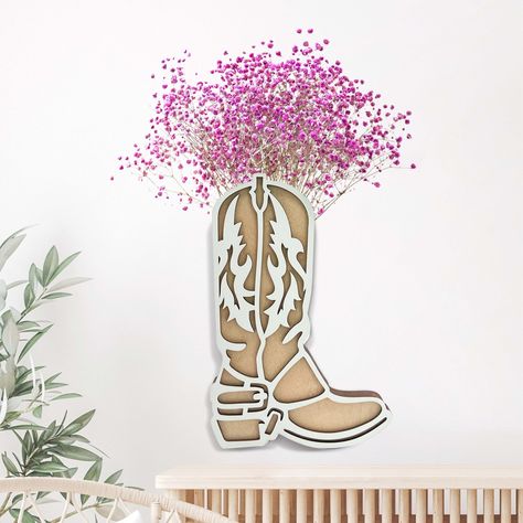 PRICES MAY VARY. Western Cowgirl Boot Decor: Our Wood Cowgirl Boot Wall Hanging, crafted with an exceptional eye for detail, embodies the iconic fashion of the Wild West, providing a unique centerpiece for tables or accent for walls. Built-in Floral Holder: The cowboy boot vase comes with a built-in floral holder, allowing you to personalize your decor using your choice of artificial flowers, succulents, or greenery, adapting to any season, occasion or color palette. Color Choices: Our cowboy bo Cowboys Centerpieces Ideas, Cowgirl Birthday Centerpieces, Cowgirl Centerpieces, Boot Centerpieces, Cowboy Boot Centerpieces, Western Table Decorations, Cowboy Boot Vase, Boot Centerpiece, Boot Wall