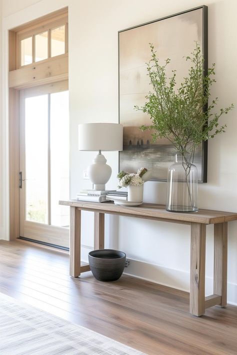 Wood narrow console table next to front door in a modern entryway Hall Tables Ideas, Entryway Console Table Ideas, Narrow Hallway Ideas Entryway, Long Narrow Entryway Ideas, Narrow Hallway Decorating Ideas, Small Entryway Decor, Apartment Entryway Decor, Simple Console Table, Hallway Table Decor