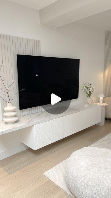 Cheryl | Interiors & Garden UK on Instagram: "D I Y  T V  W A L L - Evening all…..i haven’t shared this wall in so long. I designed this space over 3 years ago now and i still love it. - We used the @ikeauk Besta TV unit that can be wall mounted. Then we added the Laxviken door fronts in white, also from @ikeauk  - The shelf that sits on the TV unit is a laminate worktop from @bandq_uk - we cut it to size, added some matching edging strip and then screwed it from underneath to hold it on. - The panelling was made from mdf boards that were cut to strips - also from @bandq_uk it was painted in Farrow and Ball Armonite - colour matched by Valspar. - The tv is 65” @lg_uk  - The walls are painted in @duluxuk White cotton 🤍 - Any questions please ask away…. Xx - DIY TV wall | TV wall design | L Wall Decor Tv Mounted Tv, Tv Board Living Room, Tv Wall Ideas Living Room Small Spaces, Small Living Room Tv Wall Ideas, Besta Tv Unit Ideas, Ikea Tv Wall, Small Tv Wall, Tv Wall Design Small Space, Besta Tv Unit