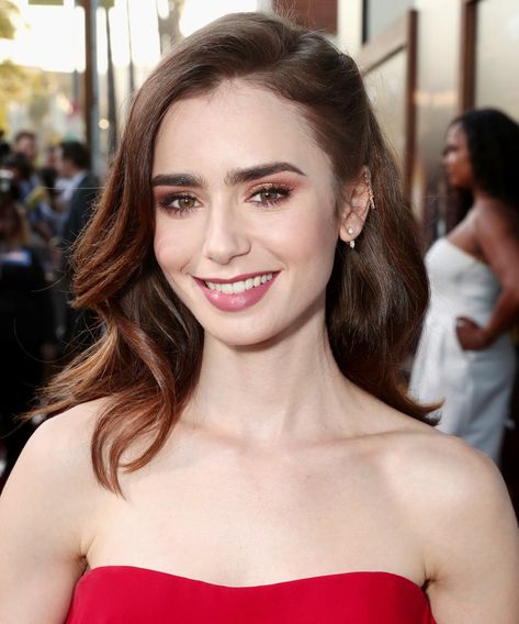 Lily Collins  | The right haircut will enhance your best features and beauty, but you can't choose the best style for you without knowing what cuts flatter your face shape. Here, we've rounded up the best haircuts for heart-shaped faces. Lily Collins Hair, Heart Face, Heart Face Shape, Lily Collins, Hair Fragrance, Cool Haircuts, Face Shape, Bob Wigs, Face Shapes