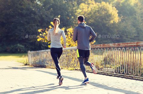 couple running or jogging outdoors by dolgachov. fitness, sport, people and jogging concept – couple running or jogging outdoors#jogging, #outdoors, #couple, #running Outdoors Couple, Sports Physical Therapy, Tracksuits For Men, Running Techniques, Lose 25 Pounds, Couple Running, Photos Booth, Learn To Run, Fitness Sport