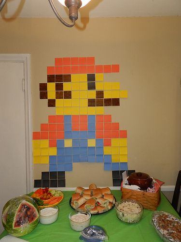 Bio Girl: Henry's Nintendo Land Birthday Party! NintendoLand 8 bit Mario out of post it notes Birthday Food Appetizers, Easy Mario Birthday Decorations, Mario Drinking Game, Classic Nintendo Party, Mario Table Centerpiece, Easy Mario Decorations, Nintendo Party Decorations, Mario Games For Birthday Party, Nintendo Decorations